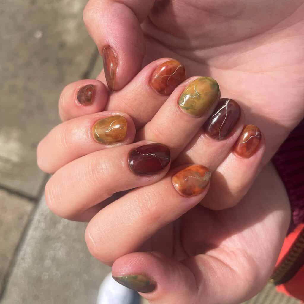 Discover the charm of amber nails with a variety of creative designs, from gel to acrylic styles. Find inspiration for your next manicure.