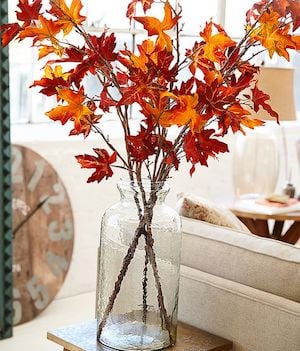 tall glass vase with fall leaf branches